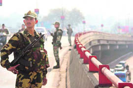 CRPF personnel keep vigil over the flyover near the M.A Stadium in Jammu on Monday.