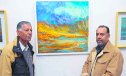 Kamal Nain Bhan with his painting at Kala Kendra in Jammu.
