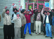 Residents protest outside the chemist shop in Jalandhar. 