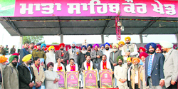 Avneet Kaur, Kuldeep Manak, Baljit Singh, and Rupinder Singh Ravi after being honoured by the organisers of Jarkhar rural games in Ludhiana on Monday.