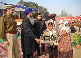 Gulzar Singh Ranike distributing tricycles and sewing machines at the Shaheed Bhagat Singh stadium in Ferozepur during the Republic Day function