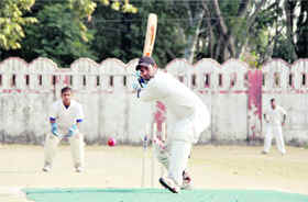 A batsman gets ready to play a shot in a match of the 58th District Cricket League in Dehradun on Wednesday.