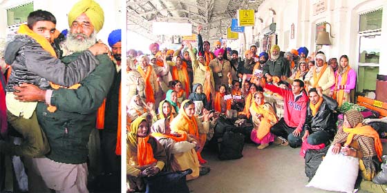 A devotee carries a physical challenged boy to a place to rest after their train was cancelled (left) and devotees protest against the cancelletion of the train to Hazoor Sahib in Ludhiana