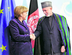 German Chancellor Angela Merkel (left) and President of Afghanistan Hamid Karzai after a news conference at the chancellery in Berlin on Wednesday.