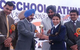 DGP Punjab Paramdeep Singh Gill flanked by senior police officials giving away prizes to the students during the annual day function at the Police Public School in Bathinda on Thursday.