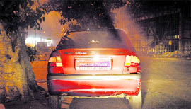 A member of the advisory committee of the Ludhiana police flaunts his membership on the car in violation of rules.