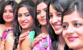 Girls wait for their turn to walk the ramp during a farewell party at GNI Public School in Ludhiana on Thursday.