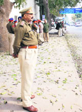 Cops guard the Mohali courts where Punjab Chief Minister Parkash Singh Badal and Deputy Chief Minister Sukhbir Badal were supposed to appear.