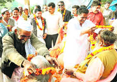Muslims welcome Ramta Panch of Juna Akhada in Jwalapur during the Maha Kumbh celebrations.
