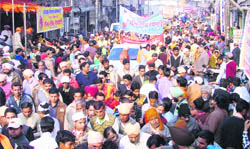 Devotees take part in a shobha yatra to mark the birth anniversary of Guru Ravidas in Ludhiana 