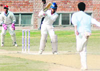 A batsman of DP Azad Cricket Academy plays a shot during a match against Mohali Cricket Academy in Sector 45, Chandigarh,