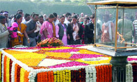 Visitors pay homage at Rajghat, the memorial of Mahatma Gandhi in New Delhi on Saturday.