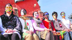 Girl students of Dronacharya B.Ed. College get their faces painted about AIDS awareness at Dharamsala 