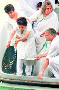 Mahatma Gandhi's family members perform a ritual after immersing his ashes in the sea off the city of Durban on Saturday.