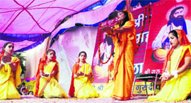 Children perform during a function on the occasion of Guru Ravi Dass Jayanti in Jammu on Saturday
