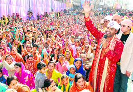 A singer performs on Guru Ravi Das Jayanti in Ludhiana on Saturday