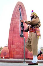 A police jawan pays homage to Mahatma Gandhi on his death anniversary at Jallianwala Bagh in Amritsar on Saturday