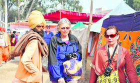 Foreigners visit Juna Akhada to click Kumbh photographs in Haridwar on Sunday.