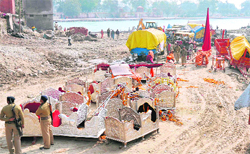Policemen at Subash Ghat guarding the Royal Chariots and carriages in Haridwar on Sunday: 