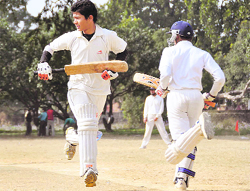 Batsmen steal a run at the Suresh Chand Gopal Memorial Cricket Tournament at Matawalabag in Dehradun on Sunday. 