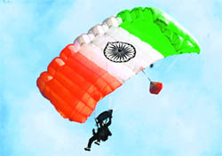 A para-jumper dives into the sky with a tricoloured parachute as part of a live demonstration during the inaugural ceremony of the country's first Aero Sports Centre at Bachhaud village in Narnaul on Sunday.