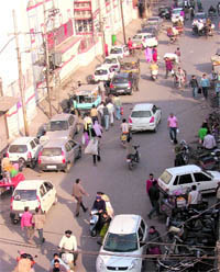 Vehicles parked on roadside in the Bhadaur House area