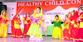 Kids perform a dance in the healthy baby contest in Ludhiana on Sunday