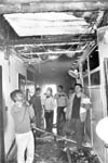Fire brigade personnel and officials assess the loss at the HUDAs headquarters where fire broke out in Panchkula