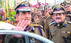 Bidding adieu: UT DGP Shanti Kumar Jain waves to fellow policemen during a farewell parade at the Police Lines at Sector 26 in Chandigarh