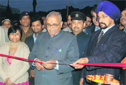 Uttarakhand Assembly Speaker Harbans Kapoor inaugurates the khadi exhibition as Karnail Singh, Director, KVIC, looks on, in Dehradun on Monday. 