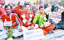 The Sevak organisation holds a protest against rising prices in Haridwar on Monday.