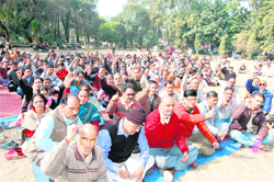 Striking ministerial employees stage a protest at the Gandhi Park in Dehradun on Monday. 