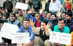 Members of the Kashmiri Pandit Welfare Movement protest in support of their demands in Jammu on Monday