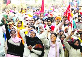 Activists of the CPM stage a protest against price rise in Amritsar
