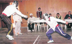 Fencers engaged in a duel during the Panjab University Inter-College Fencing (Men) Championship in Chandigarh on Tuesday.