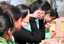 Students from Dehradun watch birds at the Asan wetlands on the Uttarakhand-Himachal Pradesh border on the occasion of World Wetlands Day on Tuesday