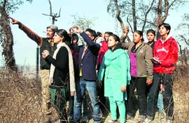 Students from Dehradun watch birds at the Asan wetlands on the Uttarakhand-Himachal Pradesh border on the occasion of World Wetlands Day on Tuesday