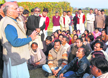 Senior BJP leader Shanta Kumar addresses party workers at Gaggal airport on Tuesday.