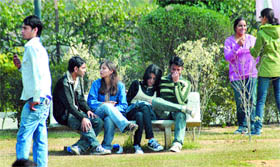 Students of Lovely Professional University enjoy a gossip session under the sun.