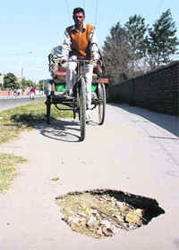 A gaping pothole on a cycle track in Sector 45, Chandigarh.