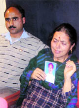 Ratna Koul, wife of an ASI who has gone missing, narrates her plight in Jammu on Wednesday. 