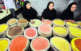 Customers stand to buy pulses at a wholesale market in Kolkata on Thursday. Annual food inflation picked up pace for the second consecutive week, strengthening the case for more fiscal steps in the Budget to tame prices.