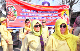 Foreigners take part in the Shri Panchayati Mahanirman Akhada Ramte Panch Peshwayi in Haridwar.