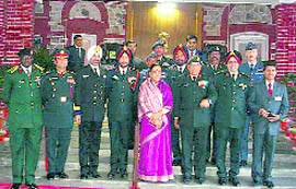 The 15-member team of National Defence College with Uttarakhand Governor Margaret Alva in Dehradun on Thursday.