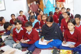Children in an evening class at one of the NCLP schools
