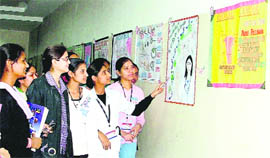 Girls at an exhibition at the Mohan Dai Oswal Cancer Treatment and Research Foundation in Ludhiana on Thursday.