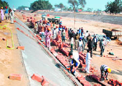 Work in progress on the relining of the Kotla feeder in Kila Hakima village in Sangrur district.