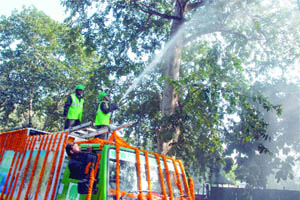 NDMC workers demonstrate the green ambulance at Janpath Road in New Delhi on Friday.