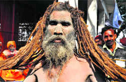 A saint shows his long hair in Haridwar on Friday.