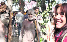 An Italian interacts with sadhus of the Atal Akhada.